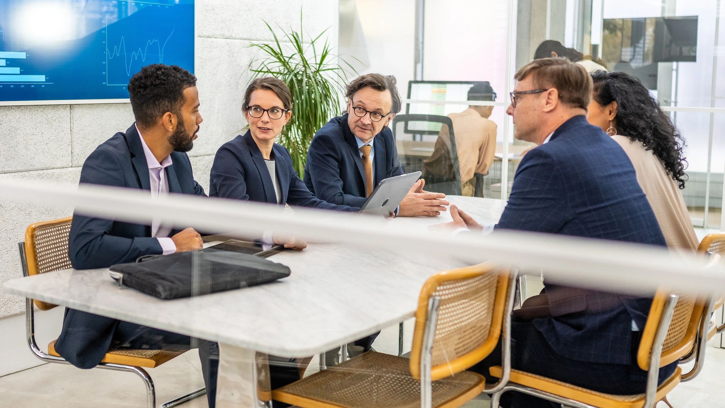 Business professionals brainstorming in a conference room
