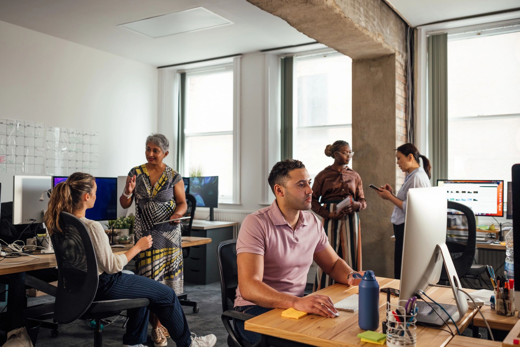 Office professionals working together on business operations